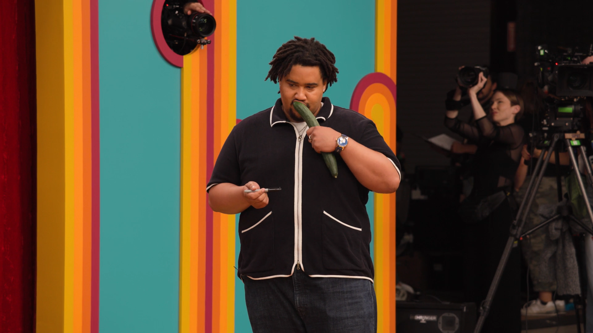 The aforementioned frame of Lou eating a cucumber