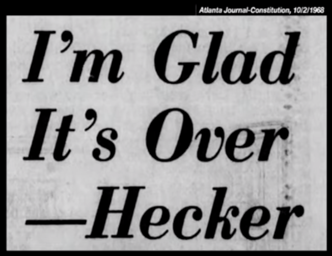 A picture of a newspaper headline reading "I'm Glad It's Over—Hecker"